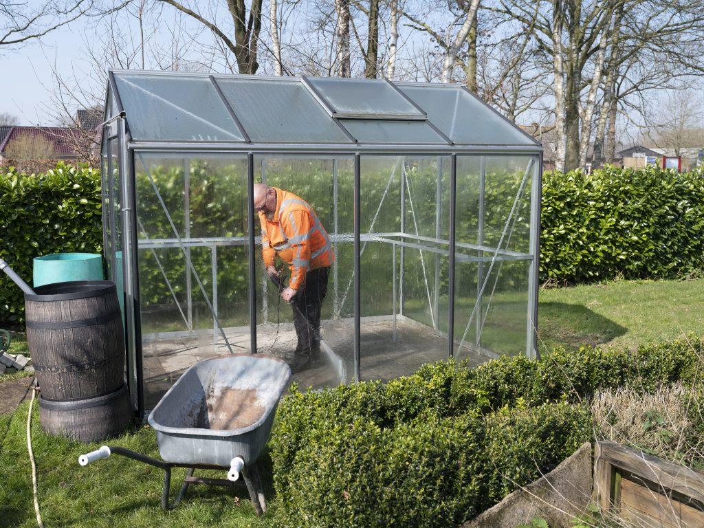 Cleaning Greenhouse with a pressure washer
